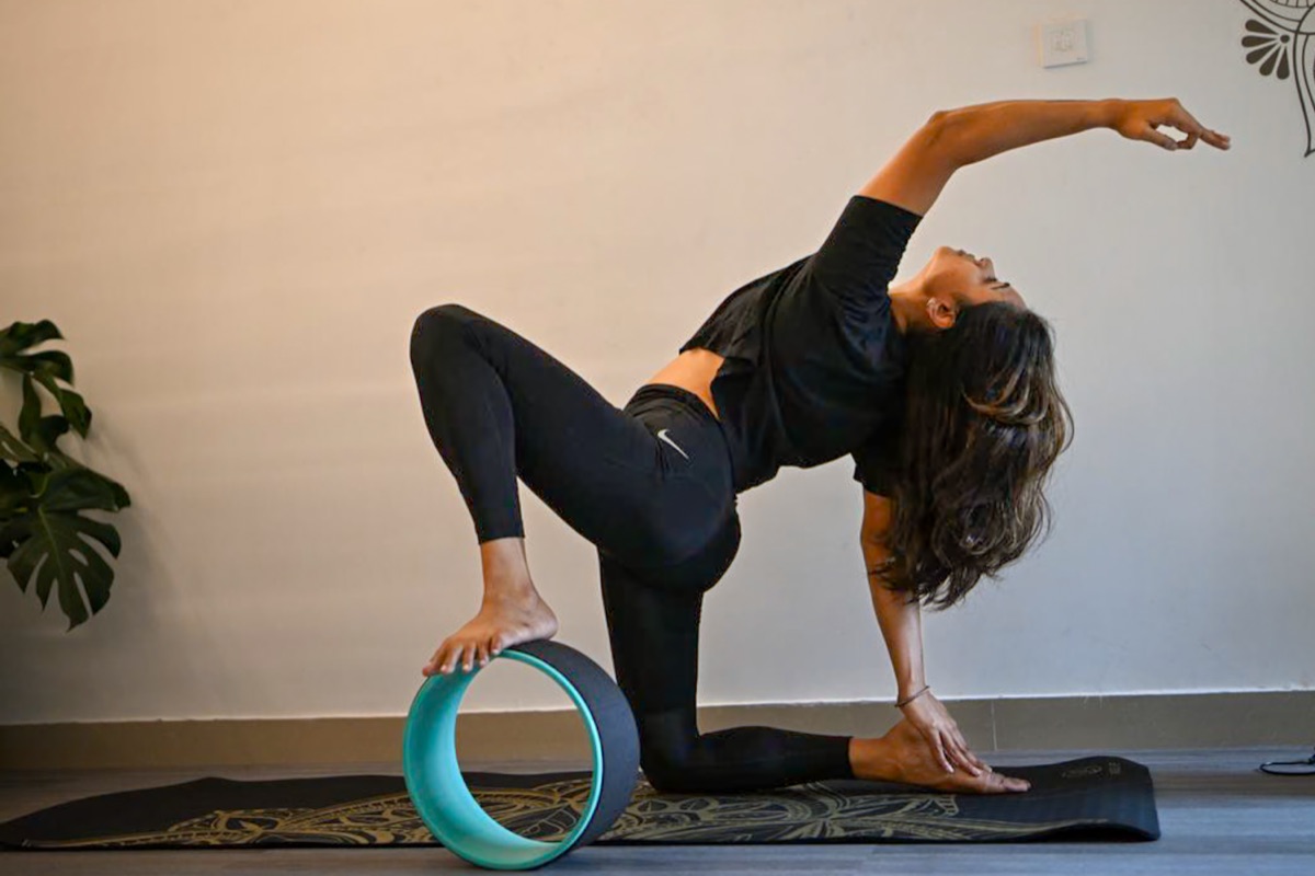 Yoga practitioner in deep alignment in studio