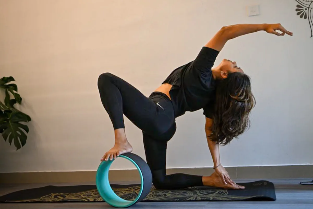 Yoga practitioner in deep alignment in studio